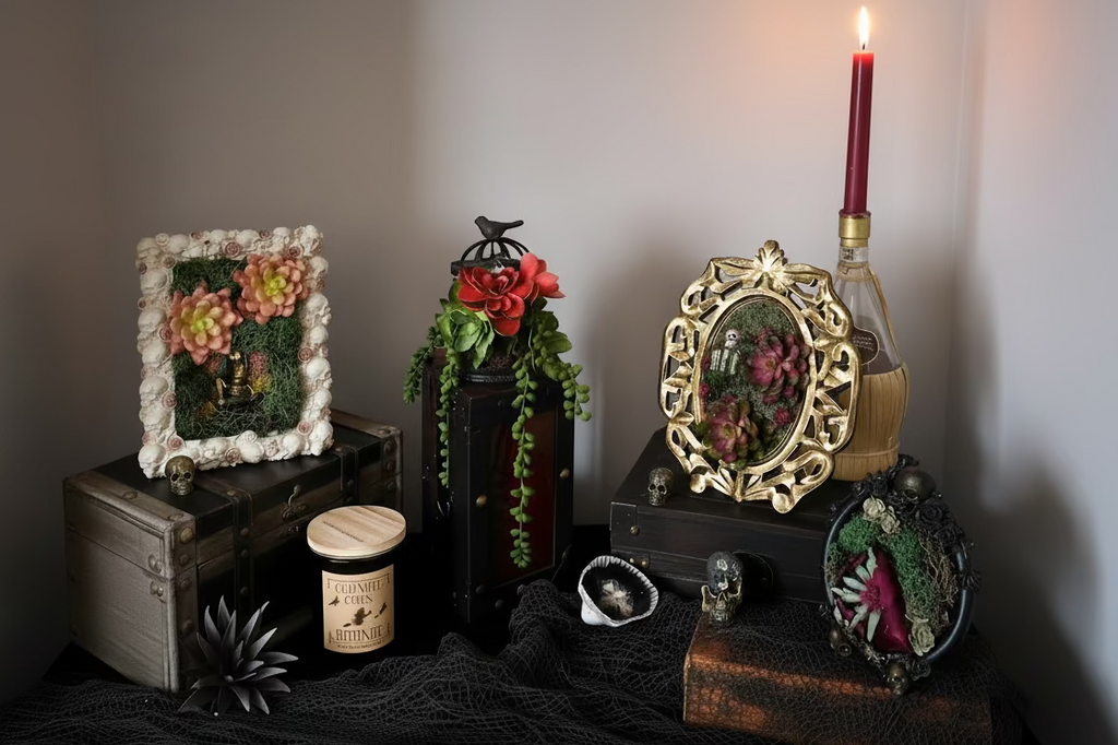 Decorative items including a framed floral arrangement, candles, and ornate objects on a textured surface.